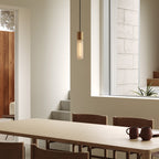 Pendentif simple en basalte et laiton