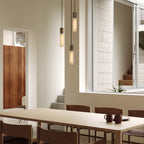 Pendentif triple en basalte et acier inoxydable