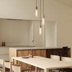 Pendentif triple en basalte et acier inoxydable